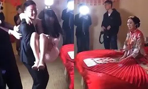 Chú rể vô tư bế thốc phù dâu trong lễ cưới, vẻ mặt của cô dâu khiến ai cũng hiểu: "To chuyện rồi"